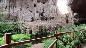 Devetashka cave, located near Letnitsa and Lovech, Bulgaria is a major tourist attraction. The cave has been visited since Paleolithic times. The clip provides a quick glance over the base and cave.