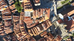 A camera drone flies forward over Porto Cathedral