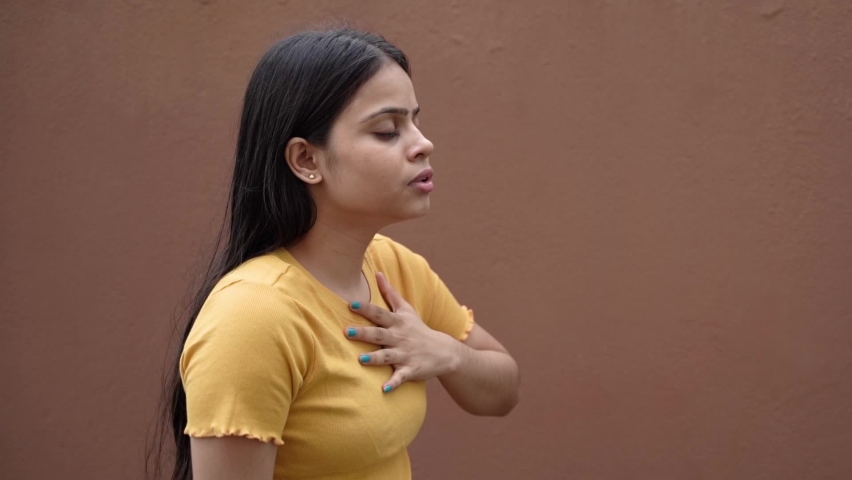 Asthmatic patient catching inhaler having an asthma attack. Slow motion Young woman having asthma, chronic obstructive pulmonary disease | Shutterstock HD Video #1092742603