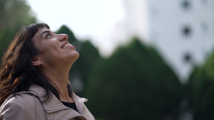 A happy Brazilian woman feeling HAPPY. An excited hispanic person looking at sky with HOPE Royalty-Free Stock Footage #1092744777