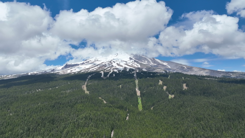Mt. Hood rises from surrounding national forest in Oregon, not far from Portland. This impressive mountain, part of the Cascade Range in the Pacific Northwest, is a potentially active stratovolcano.