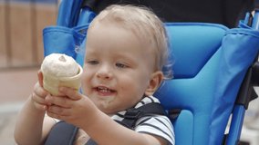 Baby boy eating ice cream for the first time