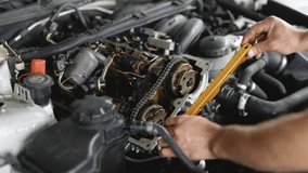 Disassembled motorcycle engine. Professional mechanic repairing motor using tool. Car mechanic repair the engine. Repairer working in garage or workshop. Man engaged servicing cars or motorbikes. - Powered by Shutterstock - Get 15% off with code: PIKWIZARD15