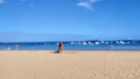 4K Blurry video of Playa de Las Teresitas, tenerife, canary Island, Spain, during sunny day.
People walking on the beautiful beach