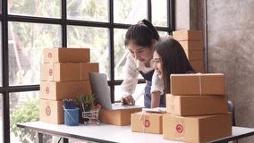 Small start-up business owner Going live selling online Check parcels at work, salespeople, check production orders. Pack products to send to customers. Sell Ecommerce Shipping Ideas.