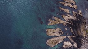 Beautiful rocks washed by the azure waters of the Atlantic Ocean, aerial video in full hd format. Picturesque landscape. Vast expanse of water.
