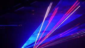 Light laser show on a black background of the night sky, outdoor performance. Multi-colored laser beams turn into various shapes, projection on smoke. Information Technology Conference - Powered by Shutterstock - Get 15% off with code: PIKWIZARD15
