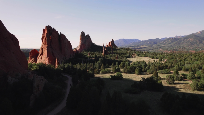 Flying Over Pines Garden of the Gods west side 4K features a view from a drone of the west side of Garden of the Gods in Colorado Springs at sunrise.