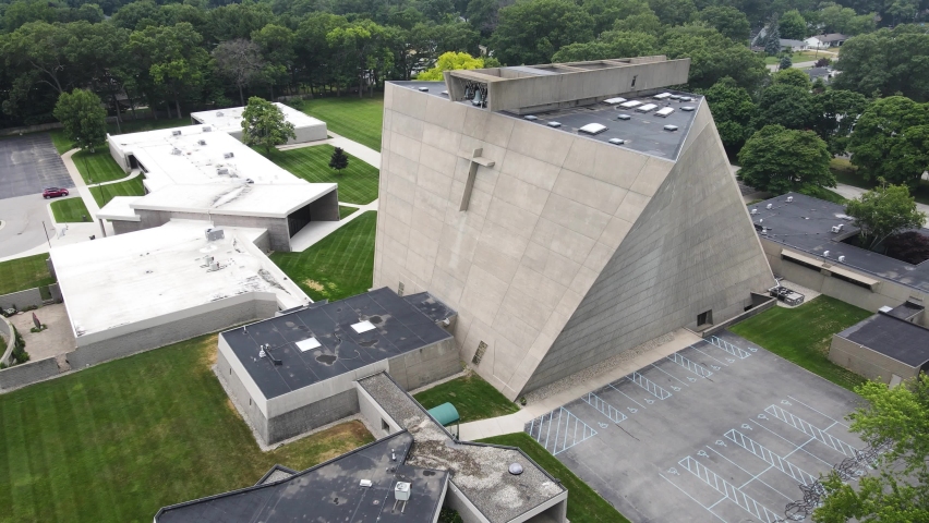 Saint Frances De Sales church in Norton Shores, MI. High angle pan and trucking motion.