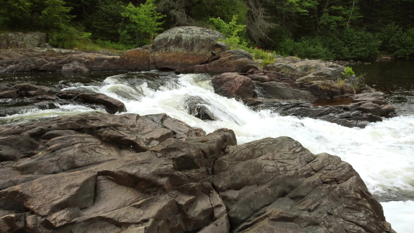 Steady shot crossing fierce river rapids Algonquin Park Ontario Canada