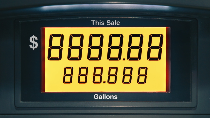 Yellow screen with highest maximum fuel price increase due to inflation in California USA. Static shot gasoline price counter on display showing gas price on digital display, gas pump meter running Royalty-Free Stock Footage #1092784485
