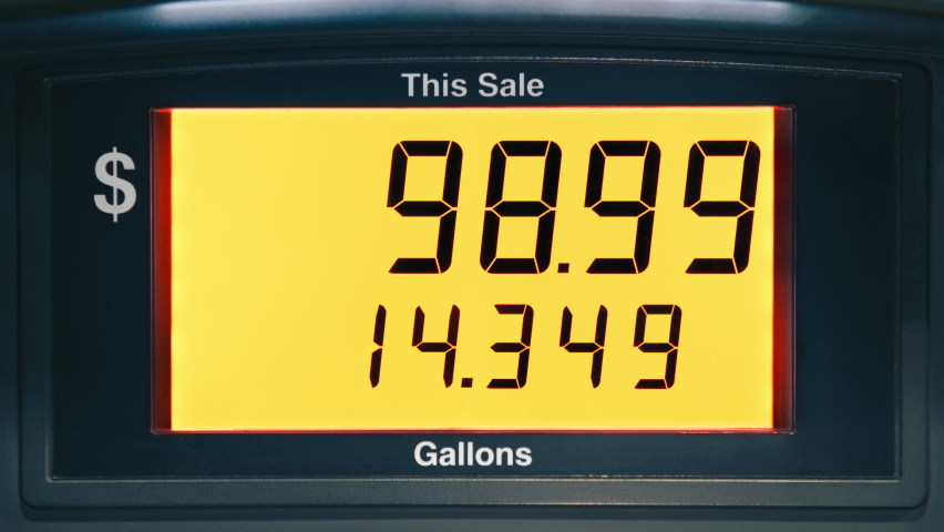 Yellow screen with highest maximum fuel price increase due to inflation in California USA. Static shot gasoline price counter on display showing gas price on digital display, gas pump meter running | Shutterstock HD Video #1092784485