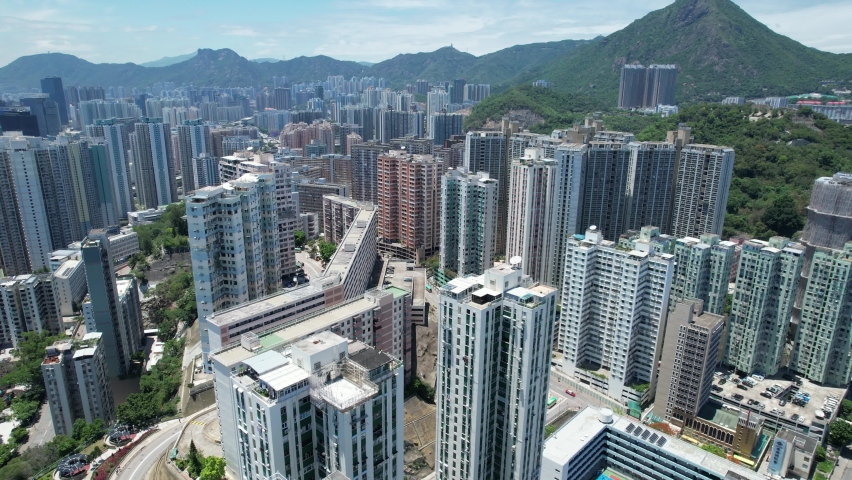 Commercial and residential construction development project in Kwun Tong of Hong Kong city, becoming the newest business district near Kowloon Bay and Victoria harbor, Aerial drone skyview | Shutterstock HD Video #1092786879