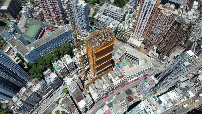 Commercial and residential construction development project in Kwun Tong of Hong Kong city, becoming the newest business district near Kowloon Bay and Victoria harbor, Aerial drone skyview | Shutterstock HD Video #1092786909