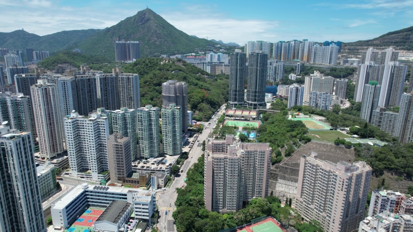 Commercial and residential construction development project in Kwun Tong of Hong Kong city, becoming the newest business district near Kowloon Bay and Victoria harbor, Aerial drone skyview | Shutterstock HD Video #1092786911