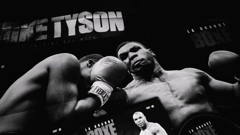 Rome, Italy - July 21, 2022, detail of the cover of two collectible DVDs on the story of boxer Mike Tyson, with two posters.