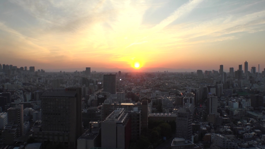 TOKYO, JAPAN - JUN 2020 : Aerial high angle sunrise view of CITYSCAPE of TOKYO around Shinjuku and Ikebukuro city. Long time lapse shot night to morning. Japanese urban metropolis in dawn.