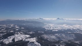 Scenic Landscape of Carpathians, Two Highest Mountains in Ukraine Hoverla and Petros in Sunny Winter Day Aerial Drone View 4k Video