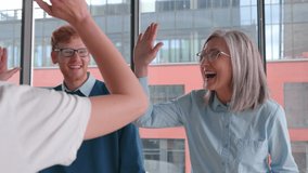 Happy excited diverse multi-ethnic business team, creative group of business people raising hands up giving high five together celebrating winning and triumph, bonding and success, teamwork and - Powered by Shutterstock - Get 15% off with code: PIKWIZARD15