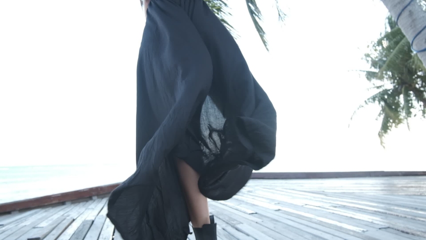 beauty woman posing in the beach club, happy face, fashion model, black color, glasses, dress