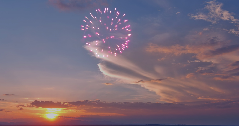 There a festive fireworks display that is launched into sky during the afternoon sunset of holiday celebration