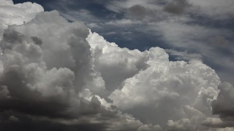 Time Lapse, Fast, furious dark, monsoon storm clouds rise dramatically, takeover blue sky. 4K UHD 3840x2160