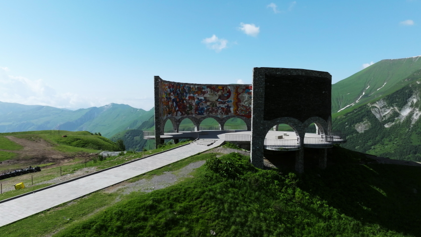 Aerial View Of Russia-Georgia Friendship Monument At Daytime In Gudauri, Georgia. - orbit