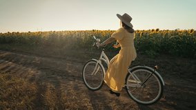 Rural woman in timeless dress riding retro styled white bicycle on country road alone near sunflowers field. Vintage fashion, amazing adventure, countryside activity, healthy lifestyle. - Powered by Shutterstock - Get 15% off with code: PIKWIZARD15