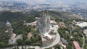 A camera drone flies around the Temple of the Sacred Heart of Jesus and Tower of the Waters of Two Rivers