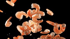 Fresh shrimp fly up and fall down. On a black background. Filmed on a high-speed camera at 1000 fps. - Powered by Shutterstock - Get 15% off with code: PIKWIZARD15