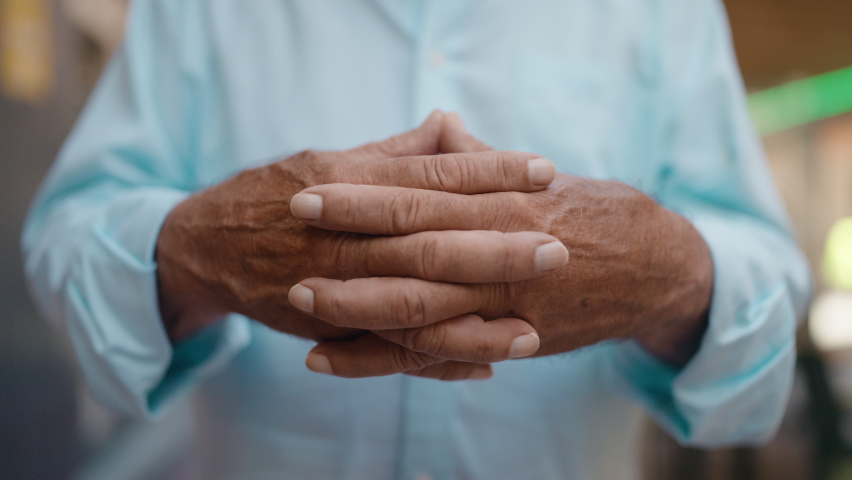 Senior grey-haired man smiling confident standing at street