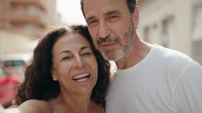 Man and woman couple smiling confident having video call at street - Powered by Shutterstock - Get 15% off with code: PIKWIZARD15