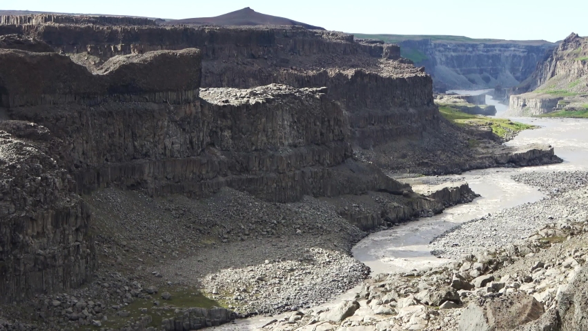 Fantastic landscape with flowing rivers and streams with rocks and grass in Iceland.