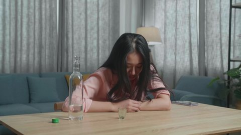 Drunk Asian Woman Looking Camera Home Stock Footage Video (100% Royalty