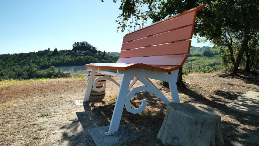 Beautiful Orange Big Bench with nice view on hills, camera still