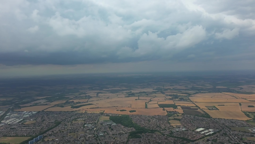 Beautiful High Angle Altitude View of Clouds and British Town of England UK, Air plane view at 360 degree.