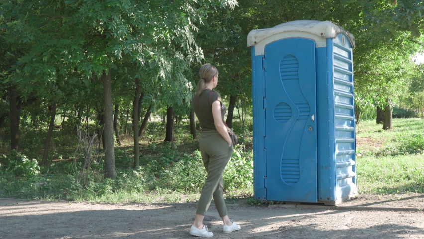 Wants to go to the toilet. Bio toilet in the park. bio toilet in the park 4. high school girl wait for toilet.