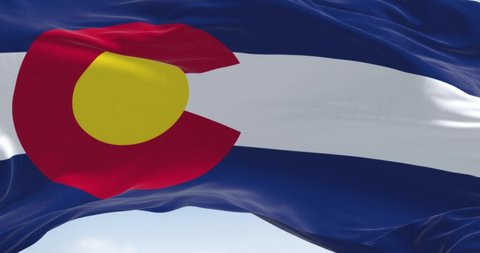 Close-up view of the Colorado flag waving. Colorado is a United States state located in the Rocky Mountains Region. Seamless loop in slow motion