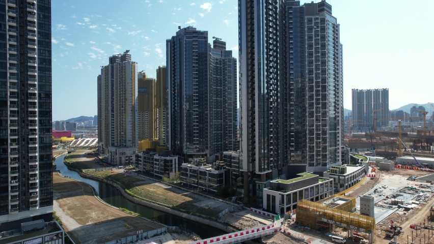 Sport theme commercial residential facility construction site in Kai Tak Hong Kong city, Kwun Tong and Kowloon Bay near Victoria harbor, Aerial drone | Shutterstock HD Video #1092850203