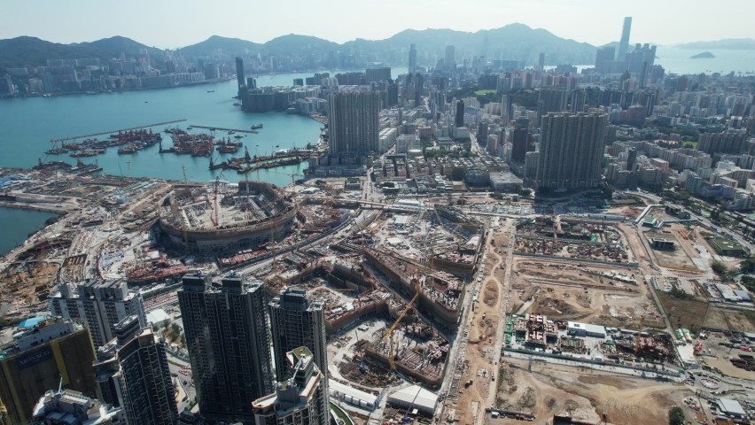 Sport theme commercial residential facility construction site in Kai Tak Hong Kong city, Kwun Tong and Kowloon Bay near Victoria harbor, Aerial drone | Shutterstock HD Video #1092850311