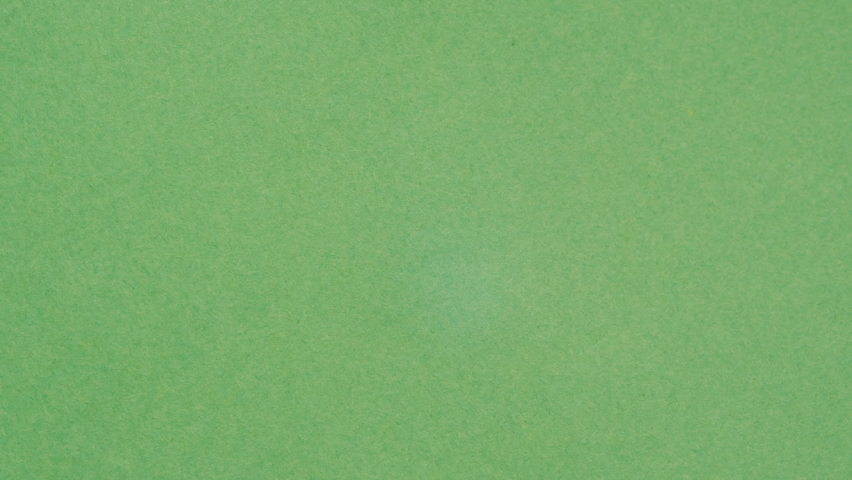 Fire flame texture close-up. Burning green paper on black chroma key background.  Royalty-Free Stock Footage #1092851783