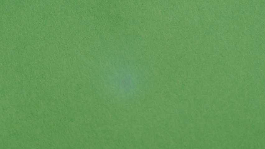 Fire flame texture close-up. Burning green paper on blue chroma key background.  Royalty-Free Stock Footage #1092851801