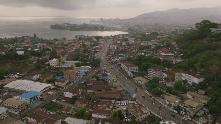 Aerial footage of a busy road in Freetown, Sierra Leone in the morning mist.