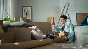 Cheerful young couple in their new apartment. Conception of moving. - Powered by Shutterstock - Get 15% off with code: PIKWIZARD15