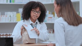 Doctor, medical professional and expert giving patient medicine, medication and pills working at a pharmacy. Happy, smiling and friendly female talking, discussing and advising client on - Powered by Shutterstock - Get 15% off with code: PIKWIZARD15