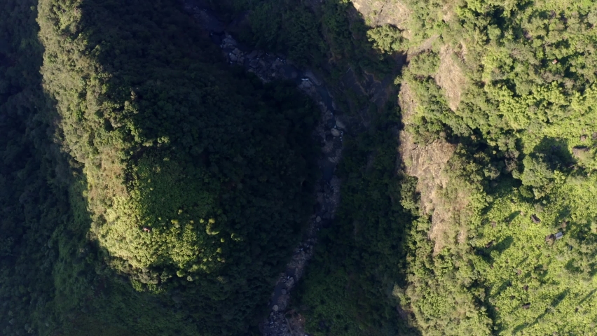 Overhead View Of Flowing Mountain Stream In The Gorge, Among The Dense Forest In Meghalaya, India. Aerial Drone Shot Royalty-Free Stock Footage #1092891975