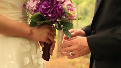 Groom holding bride's hands with love Stock Video