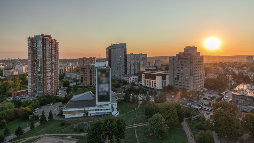 Kharkiv city panorama from above day to night transition after sunset timelapse. Aerial view of residential districts near botanical garden metro station. Ukraine.