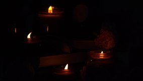 A set of different aroma candles in brown glass jars and flowers. Scented handmade candle. Soy candles are burning in a jar. Aromatherapy and relax in spa and home. Fire in brown jar. Dark evening - Powered by Shutterstock - Get 15% off with code: PIKWIZARD15