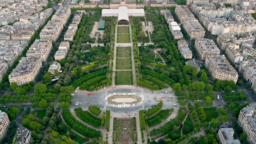 Paris, France, June 2022.Amazing golden hour footage of the city with pov from the top of the Eiffel tower.The tilt movement gives us a complete view of the Champ de Mars. Royalty-Free Stock Footage #1092918213